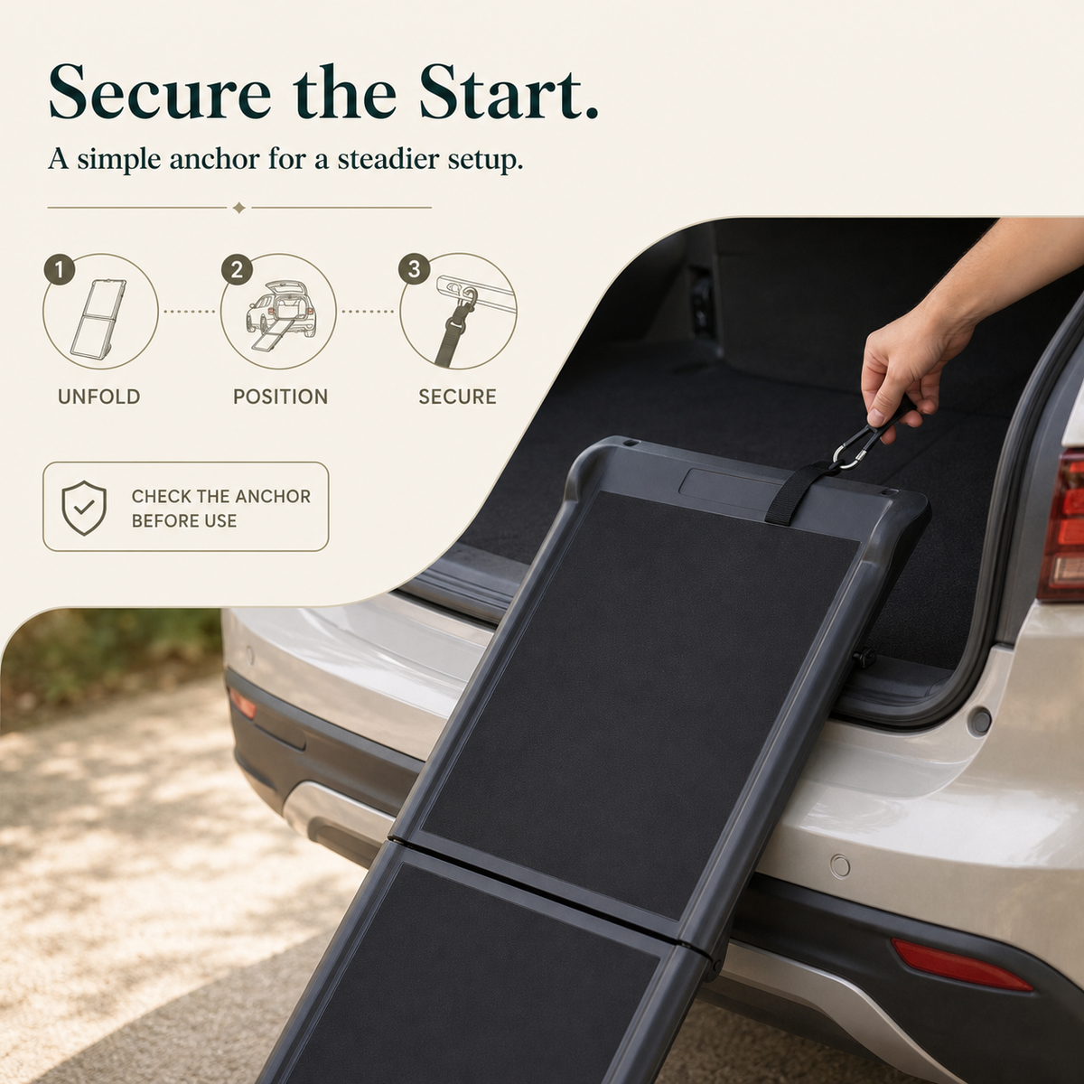 Black pet ramp securing strap and hook setup at vehicle
