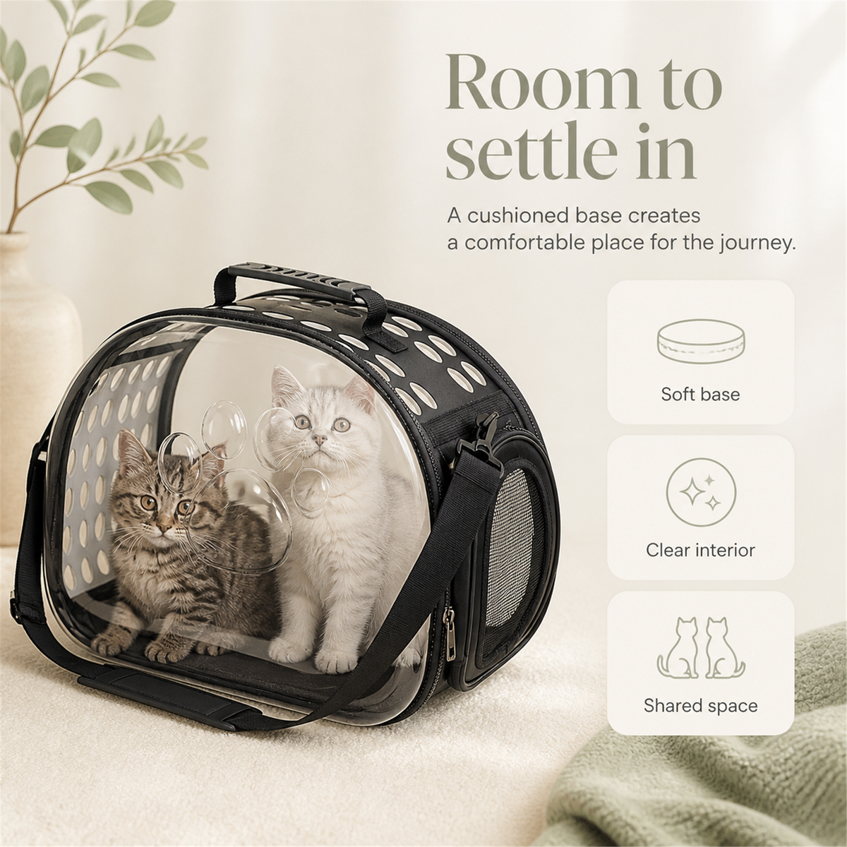 Two kittens inside the cushioned clear-front pet carrier