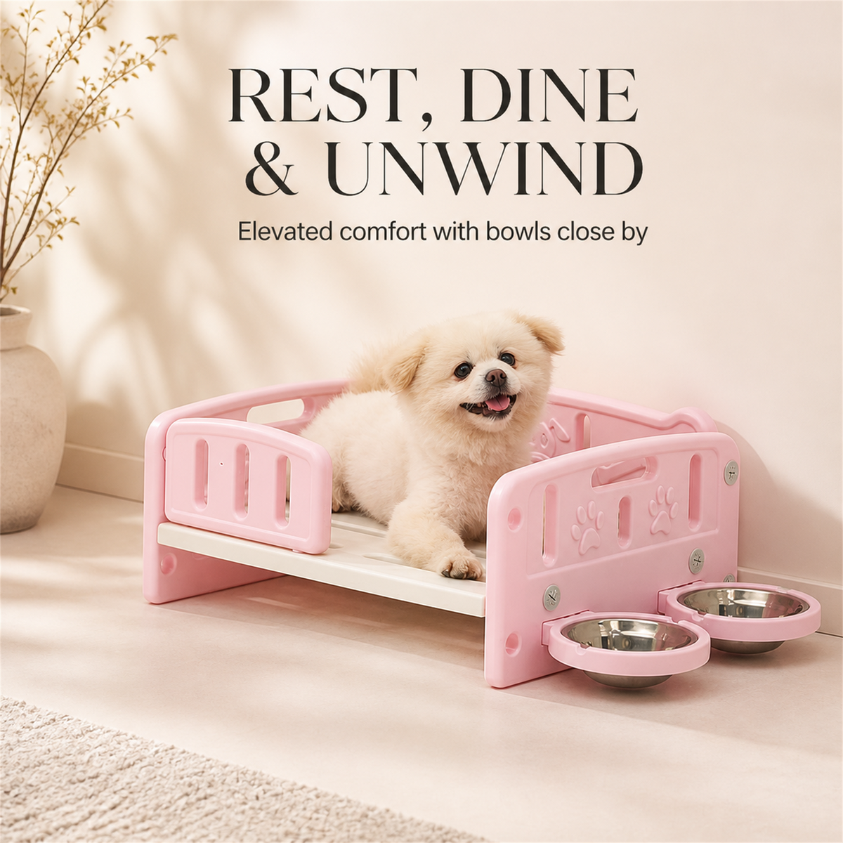 Pink elevated pet bed with two stainless steel bowls for small dogs and cats