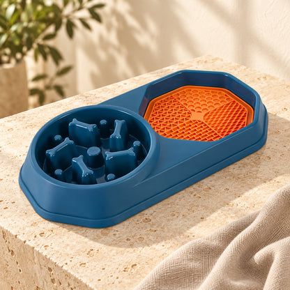 Blue pet slow feeder bowl with orange textured licking mat on a stone platform